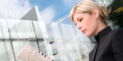 Woman Reading Paper