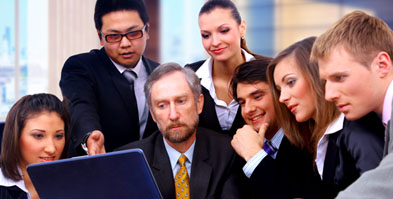 Group of people looking at a computer